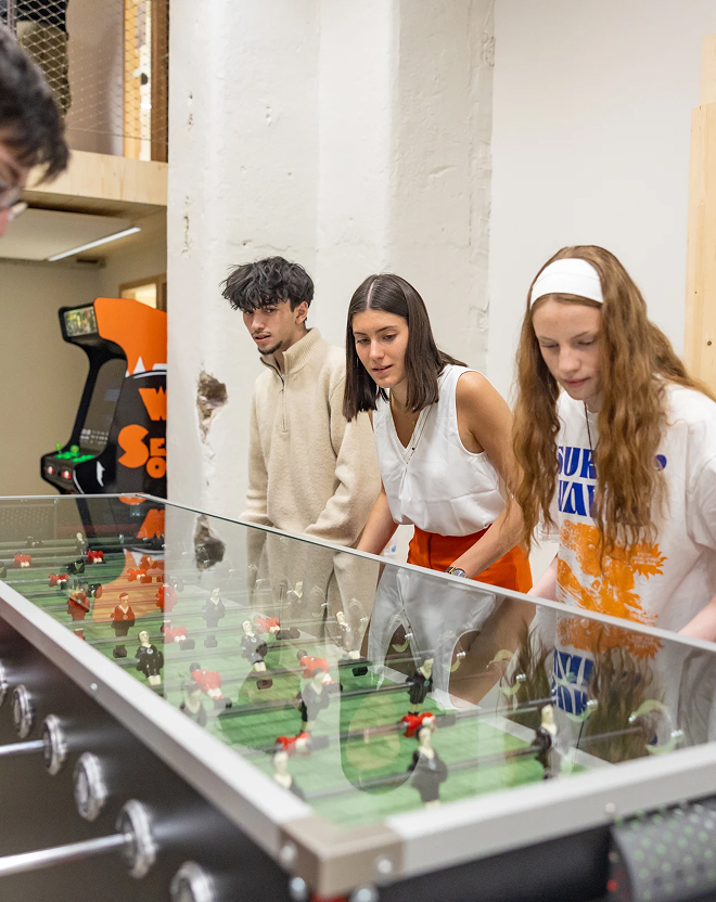 Students playing foosball on the Rennes campus of the ECE business school