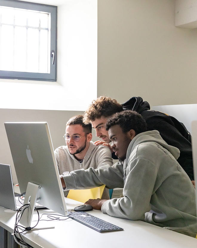 Students working on a Mac at the Rennes campus of the ECE business school