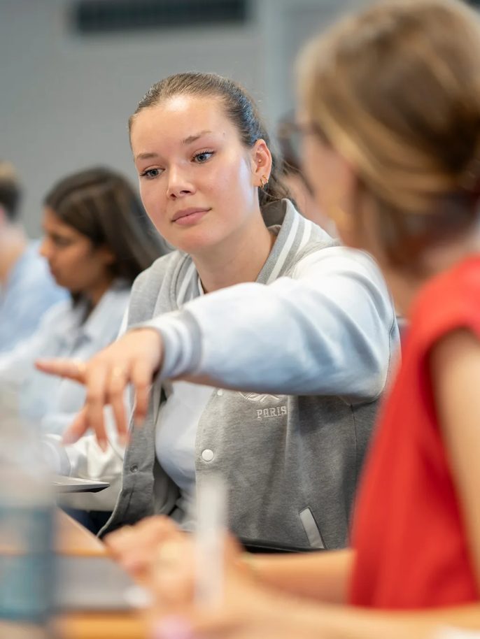 Two students working on a project in a classroom at ECE.