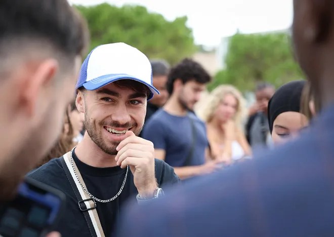 A student wearing a cap on the campus of the ECE engineering school in Marseille